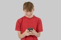 Teenage boy typing a text message Royalty Free Stock Photo