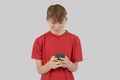 Teenage boy typing a text message Royalty Free Stock Photo