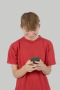 Teenage boy typing a text message Royalty Free Stock Photo