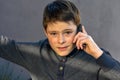 Teenage boy using cellphone, he gets bad news