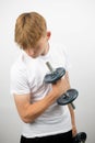 Teenage boy using a dumbbell Royalty Free Stock Photo