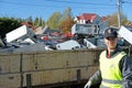 Teenage boy volunteering for a christian charity organization collecting electonic waste to raise money for missionaries