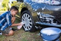 Teenage boy washing a car Royalty Free Stock Photo