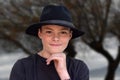 Teenage boy wearing black fedora hat Royalty Free Stock Photo