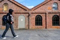 Teenage Boy Wearing Black Hoodie And Backpack Walking Royalty Free Stock Photo