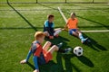 Teenage boys football team talking on soccer field Royalty Free Stock Photo