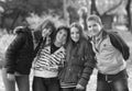 Teenage boys and girl having fun in park in spring Royalty Free Stock Photo