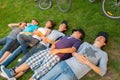 Teenage boys and girls lying on the grass Royalty Free Stock Photo