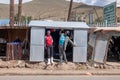 Teenage boys pose for the camera outside a shop in the town of Mokhotlong, Lesotho in Africa.