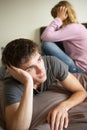 Teenage Couple In Bedroom After Argument