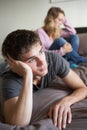 Teenage Couple In Bedroom After Argument