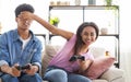 Teenage Couple Enjoying Playing Videogame On Playstation