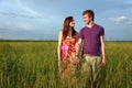 Teenage couple in field Royalty Free Stock Photo