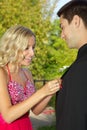 Teenage Couple Going to the Prom Putting on Boyfriend's Boutonniere