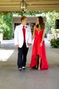 Teenage Couple Going to the Prom Walking and Smiling at Each Other