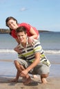 Teenage Couple Having Fun On Beach