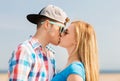 Teenage couple kissing outdoors