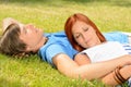 Teenage couple relaxing on grass closed eyes Royalty Free Stock Photo