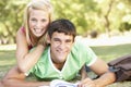 Teenage Couple Studying Together In Park Royalty Free Stock Photo