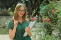 Teenage, cute young girl student in black eyeglasses, holding books. Summer holidays, education, concept - smiling female student Royalty Free Stock Photo