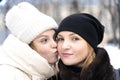 Teenage daughter emotionally kisses mom on the cheek Royalty Free Stock Photo