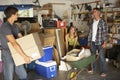 Teenage Family Clearing Garage For Yard Sale Royalty Free Stock Photo