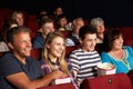 Teenage Family Watching Film In Cinema Royalty Free Stock Photo