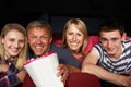 Teenage Family Watching Film In Cinema Royalty Free Stock Photo