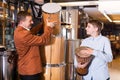 Teenage and father choosing ethnic drum