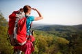 Teenage female hiker watching in distance