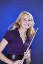 Teenage Flute Player Isolated on Blue Royalty Free Stock Photo