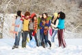 Teenage Friends Having Fun In Snowy Landscape Royalty Free Stock Photo