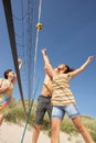 Teenage Friends Playing Volleyball On Beach Royalty Free Stock Photo