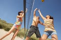 Teenage Friends Playing Volleyball On Beach Royalty Free Stock Photo