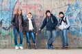 Teenage friends with school bags and skateboards Royalty Free Stock Photo