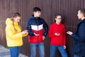 Teenage friends spending time in city streets Royalty Free Stock Photo