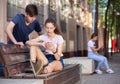 Teenage girl absorbed in phone, ignoring boyfriend Royalty Free Stock Photo