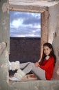 A teenage girl in an ancient abandoned Arab building
