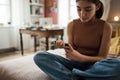 Teenage girl applicating insulin with insulin pen.