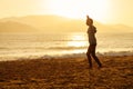 Teenage girl balance slackline silhouette on the beach Royalty Free Stock Photo