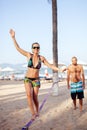 Teenage girl balancing on slackline