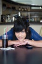 Teenage girl in bar Royalty Free Stock Photo