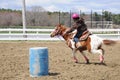 Teenage girl barrel racing Royalty Free Stock Photo