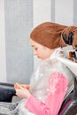 Teenage girl in a beauty salon on hair coloring and a haircut. Beauty concept. haircut, coloring Royalty Free Stock Photo