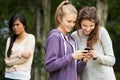 Teenage Girl Being Bullied By Text Message On Mobile Phone Royalty Free Stock Photo