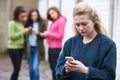 Teenage Girl Being Bullied By Text Message