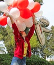 A teenage girl with birthday balloons