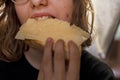 teenage girl bites a sandwich cheese Royalty Free Stock Photo