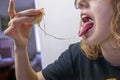 teenage girl bites a sandwich with cheese Royalty Free Stock Photo