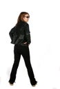 Teenage girl in black jeans and leather jacket Royalty Free Stock Photo